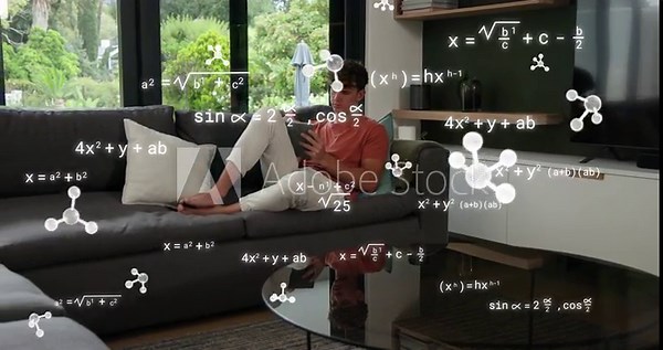 Man tapping tablet on sofa and generating animated molecules and formulas around him for education