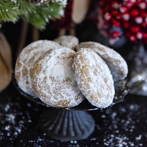 Pfeffernusse Cookies: these German holiday cookies are similar to American gingerbread cookies, but are filled with extra spices and tossed in powdered sugar! RECIPE: https://thenovicechefblog.com/pfeffernusse-cookies/ | The Novice Chef