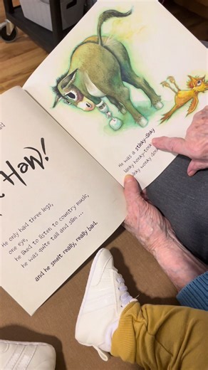 Today’s life enrichment session looked simple from the outside. A woman. A baby. A book. But what you’re really seeing is sensory connection, role memory, nurturing response, and emotional regulation all happening in real time. Doll therapy is not just about the doll. It’s about access. Access to comfort. Access to identity. Access to moments that still feel familiar and safe. And today, that access looked like story time with a very silly book titled #TheWonkyDonkey