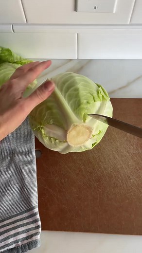 Here’s how I core cabbage, cutting the core out before I slice through the whole. Cabbage heads are so big! So it’s easier to manage them once the core is out and the giant is cut in half. Cabbage that you cut and shred yourself has such better texture and flavor than the bagged slaws. Plus, that core is pretty dense, and it can be a chore to cut down through it, so that’s one reason why I cut it out first. The other reason is, when making our stuffed cabbage we work with the whole cabbage head 