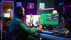 Musician playing piano keyboard and recording tracks for mix and master session, using digital software on pc to create new songs. Sound producer composing music with midi controller tool. Camera B.