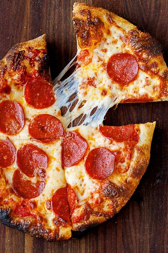 This Sourdough Pizza Dough Recipe makes the best, perfectly crispy, and chewy pizza dough crust! 🍕RECIPE: https://natashaskitchen.com/sourdough-pizza-dough/ | NatashasKitchen.com