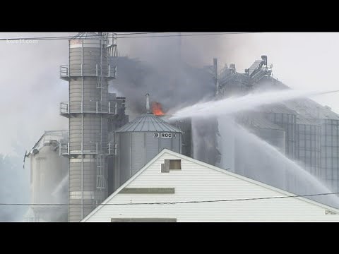 More than 16 hours after a grain elevator caught on fire, crews are still fighting the flames