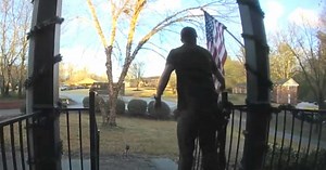 UPS driver stops to fix family's tangled American flag