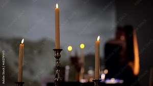 Slow dance of a couple in love during a romantic dinner by candlelight