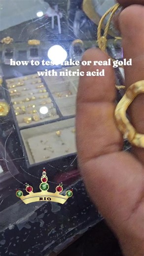 someone brought gold coated jewellery for sell but we had to file it and use acid on it for proper testing #original gold shop in uganda #kampala #trending #rio_jewellers #we buy gold