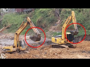 Zoomlion Ze210e and Komatsu 210 pc Excavators digging water plan system in the canal