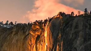 Visitors watch 'firefall' illusion created at sunset in California