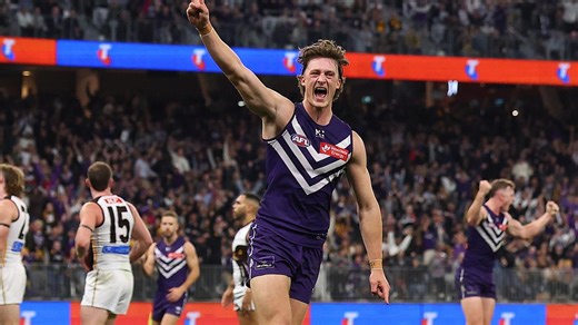 Fremantle Dockers play "Wharfie Time" during the clash with Hawthorn.