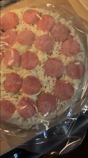 Digiorno rising crust pepperoni pizza about to be baked.