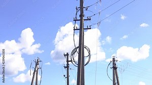 Portable grounding. Temporary grounding of power lines. Grounding power lines. The power lineman use clamp stick (insulated tool) to closing a transformer on energized high-voltage electric power line