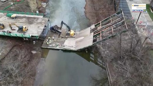 A look from above at the aftermath of the Washington Avenue Bridge collapse that occurred Wednesday afternoon in Wheeling from Skyview9. MORE: https://wtov9.com/news/local/bridge-collapse-on-washington-avenue-leaves-emergency-crews-racing-to-rescue-victims-bridge-collapse-washington-avenue-emergency-crews-rescue-operations-wheeling-creek-police-firefighters-road-closure | WTOV NEWS9