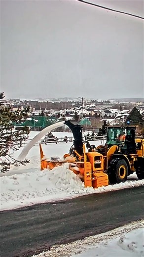 City snow blower clearing our street