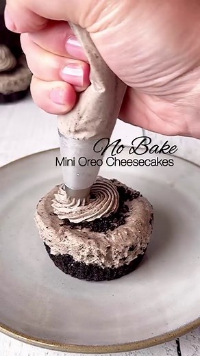 Only 6 ingredients! No Bake Mini Oreo Cheesecakes. Happy Mother’s Day to all the moms💐 What you will need: Oreo Crust: * 1 package of Oreos @oreo * 1 stick unsalted butter, melted Oreo Cream Cheese Filling: * 2, 8 oz cream cheese * 1 cup heavy whipping cream * 1/2 cup granulated sugar * 1 tsp vanilla extract Instructions: * Ground Oreos to crumbs. Save about 1 cup for filling and topping. Add melted butter to remaining Oreos and combine to make the crust. * Make whip cream by whipping together 