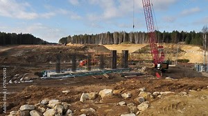 Installation of building structures for construction of new bridge, overpass