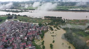 China ramps up efforts as surging rivers threaten more areas
