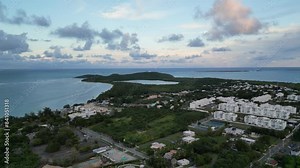 fajardo puerto rico aerial drone footage flying towards seven seas beach (tropical island getaway sunset dusk) hotel town city coast coastal shore travel getaway luxury torism