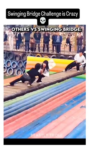 UniverseIQ | The post shares a 34-second viral video compilation of festival-goers in Asia hilariously failing to cross unstable swinging bridges over... | Instagram