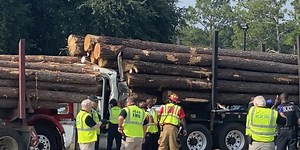Driver hospitalized with ‘severe injuries’ after log truck vs. log truck crash