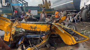 The 14-seater bus being removed by emergency service workers from the accident scene. Six persons died in the accident that happened in front of NIPCO GAS Station, opposite Prayer City, Mountain of Fire and Miracles Ministry headquarters, outbound Lagos, along the Lagos-Ibadan Expressway. The accident happened when a gas truck coming from NIPCO collided with the 14 seaters bus and a fuel tanker Credit: Eniola Daniels for The Guardian #LagosIbadanExpressway #TrafficUpdate | Guardian Nigeria