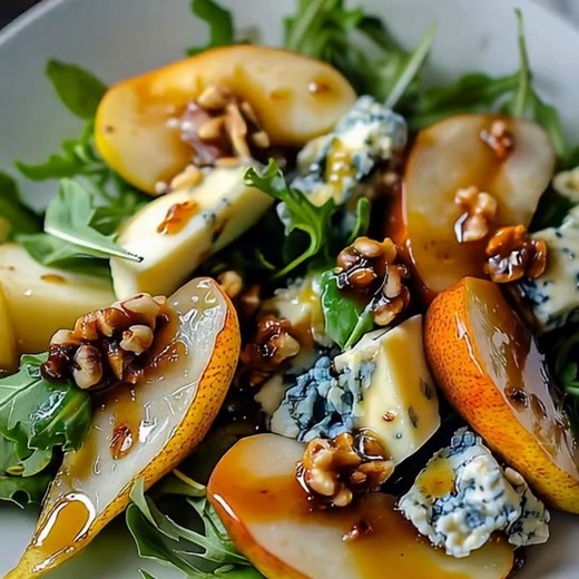 Caramelized Pear and Blue Cheese Salad Ingredients: 1. 2 ripe pears, sliced 2. 1 tablespoon butter 3. 1 tablespoon honey or maple syrup 4. 6 cups mixed greens (arugula, spinach, or spring mix) 5. ½ cup crumbled blue cheese 6. ¼ cup candied walnuts or pecans 7. ¼ red onion, thinly sliced 8. ¼ cup dried cranberries 9. 2 tablespoons balsamic glaze (or balsamic vinaigrette) Directions: 1. Caramelize the Pears: 1.1. In a skillet, melt the butter over medium heat. 1.2. Add the sliced pears and cook fo