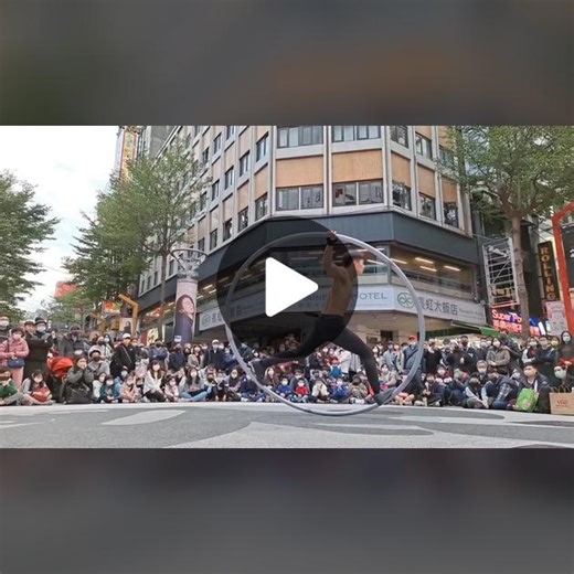 Acrobatic Cyr Wheel Performance in Urban Setting