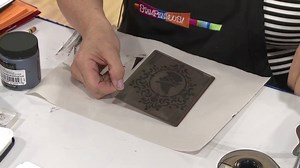 In this video, Monica from Stampendous! shows how to apply glitter to a stencil image. | Stamp & Scrapbook Expo