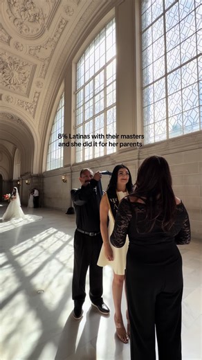 Proud Latina Graduates with Master's Degree