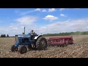 Ford 8600 tractor pulling a Case IH No Till drill in Michigan