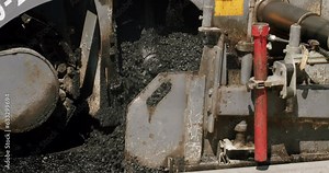 Roadway repair. Heavy machinery. Asphalt Road Construction. Asphalt paver machine on a road construction site. Asphalt laying. Road rollers drive on a new road.