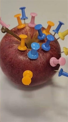 Wrong Way to Use Push Pins on an Orange