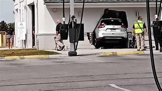 SUV crashes into car wash, leaving hole in wall