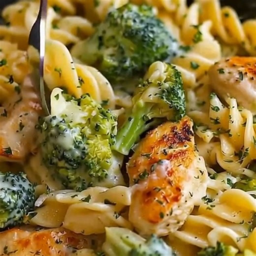 Cheesy Garlic Chicken and Broccoli Pasta Ingredients: 12 oz penne or rotini pasta 2 tablespoons olive oil 1 pound boneless skinless chicken breast, cut into bite-sized pieces 4 cups broccoli florets 4 cloves garlic, minced 2 tablespoons all-purpose flour 2 cups milk 1 cup chicken broth 1 teaspoon salt ½ teaspoon black pepper 1½ cups shredded cheddar cheese ½ cup grated Parmesan cheese Directions: Cook the Pasta: 1.1. Cook the pasta according to the package instructions. 1.2. Add the broccoli flo
