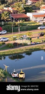 Lagoa Santa, Goias, Brazil - 05 05 2024. Vertical drone pan from left to right beginning close to the lakeside and gradually revealing a wider view of the municipal lake landscape Stock Video Footage - Alamy