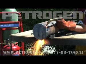 Petrogen oxy gasoline cutting torch cuts a 12 inch steel shaft.wmv