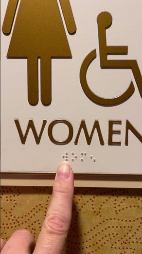 How to read the braille on the women’s restroom sign.