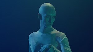 A pale skin alien gracefully moves and gazes in every direction in the middle of the night - Free Stock Video