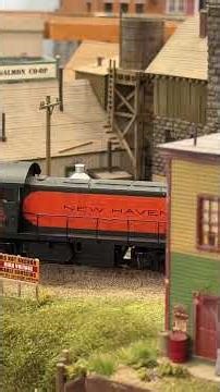 HO Scale Trains Running on Bridge