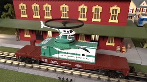 MTH Spotlight http://mthtrains.com/railking/spotlight/01_2015/c Looking to add a little excitement to your Railroad Empire. How about a just arrived 2015 MTH RailKing O Gauge Flat Car with Operating Helicopter. Featured in the 2015 RailKing & Premier O Gauge Trains Catalog the RailKing Flat Car with Helicopter comes in Pennsylvania 30-79455 and New York Central 30-79456 road names. The MTH RailKing Flat Car with Operating Helicopter operates on O-27 curves and these 2015 models have a MSRP of $7