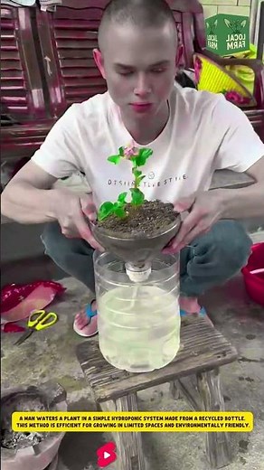 A man waters a plant in a simple hydroponic system made from a recycled bottle
