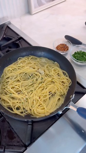In honor of PRIME DAY today I am whipping up my Spaghetti Aglio e Olio using my 10 pc Stainless Steel Cookware Set! This is on MAJOR sale today so take advantage and order before it sells out! Follow along in my stories for all my deals @bydash @amazon 💥 Full recipe on foodnetwork.com Kosher salt 1 pound dried spaghetti 1/2 cup extra-virgin olive oil, plus more for finishing 1 teaspoon crushed red pepper flakes 4 cloves garlic, thinly sliced 1/2 cup rough-chopped fresh parsley #prime #primeday