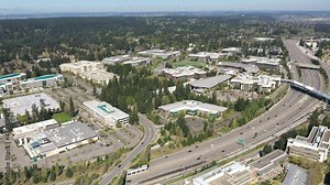 Cinematic drone dolly video of the Microsoft Corporate Headquarters, Microsoft Commons, Microsoft Studio in Overlake and Redmond, Washington, near Bellevue, Seattle