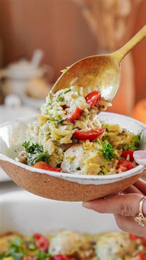 Maria Koutsogiannis 🇬🇷 Greek Food Blogger on Instagram: "This Chicken Orzo Bake is a whole vibe & your newest lover 😲✨ Flavor-packed meatballs, juicy tomatoes, and orzo all in one easy bake. Minimal mess, maximum deliciousness. 👩🏻‍🍳🧿🔪Comment ‘recipe’ in the comments below for the pita and gyro recipe — I’ll send it straight to your DMs 📧 Welcome Back to Episode 5 of Sheet — that’s goood! Today we’re making your next obsession. Introducing, Sheet Pan Chicken Orzo Bake. #latourangellepart