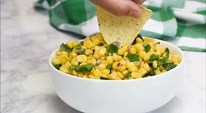 Our easy copycat recipe is perfect for making Chipotle’s famous Corn Salsa with Roasted Chili at home, using just 7 simple ingredients! Get the recipe here! https://www.aspicyperspective.com/chipotle-corn-salsa-recipe-with-roasted-chili/ | A SPICY PERSPECTIVE