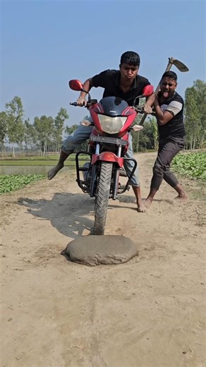 The boy cleaned up the dirt on the street.