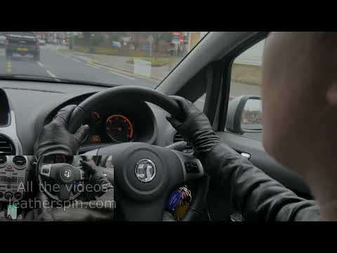 Girl driving in leather gloves with leather boots leather jacket and leather pants