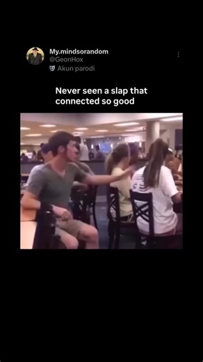 MY.MINDSORANDOM on Instagram: "This clip is a flawless little physics lesson disguised as comedy: Action → Ego → Immediate karma. We’re in a busy university dining hall. Plates clinking, people chatting, background chaos everywhere. Normal day. Then one guy decides it’s prank o’clock. He leans over and pulls the oldest trick in human history — the classic tap-someone-on-the-opposite-shoulder. A move so ancient it probably existed in caveman times. She turns her head, confused, scanning for the c