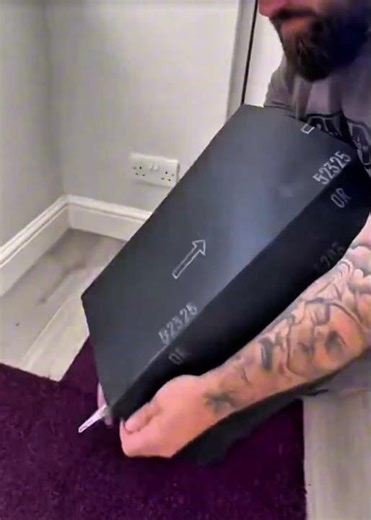 This man demonstrates how to cut carpet using a utility knife to create boundaries between floors