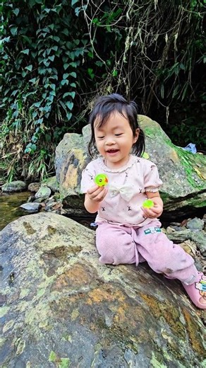 The little girl ate candy with her mother.