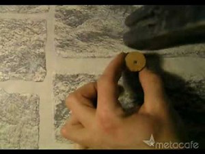 How to hammer a nail into a hard wall